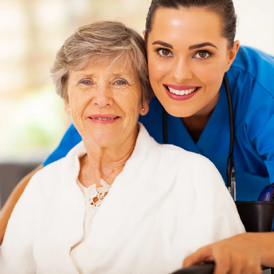 Smiling senior woman with caregiver.